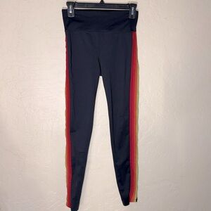 NOLI YOGA Black Blaze Leggings with Orange Tuxedo Stripe. Rainbow side stripes